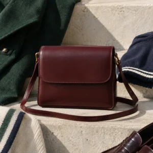 Oxblood Mini Satchel, oxblood: small structured oxblood satchel with clean flap and slim shoulder strap